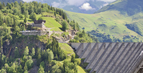 Scenic view of roseland dam in the french alpes mountains against sky