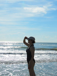 Woman standing on beach