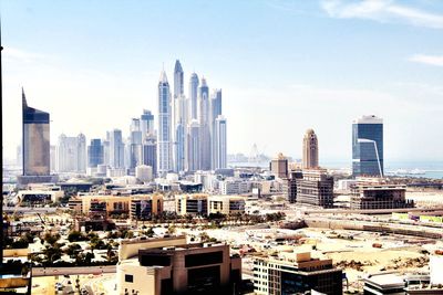 Modern buildings in city against sky