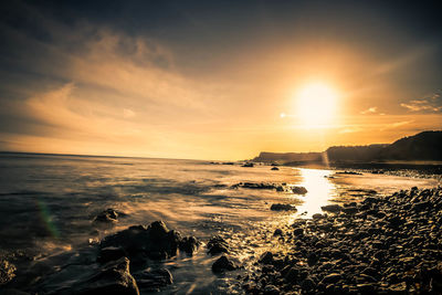 Scenic view of sea against sky during sunset