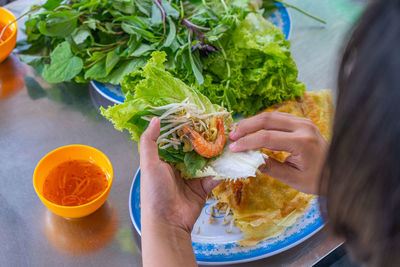 High angle view of woman eating food