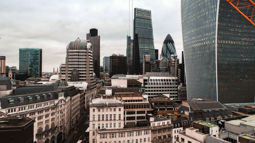 Modern buildings in city against sky