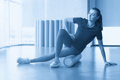 Young woman exercising in gym