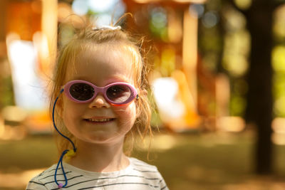 Portrait of young woman wearing sunglasses