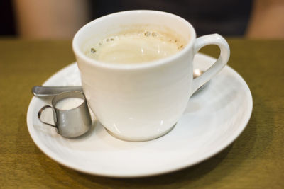 Close-up of coffee cup on table