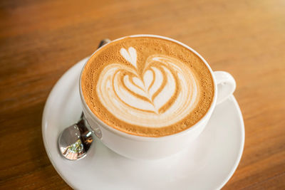 High angle view of cappuccino on table