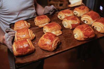 Making pain au chocolat in bakery 