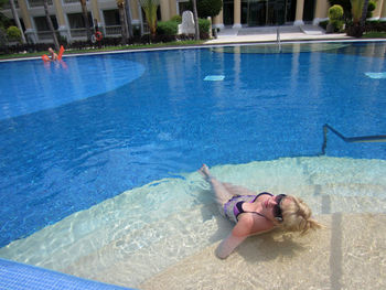 High angle view of sensuous woman wearing bikini in swimming pool