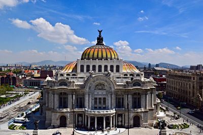 Facade of historic building against sky in city