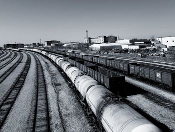 Train on railroad tracks against clear sky