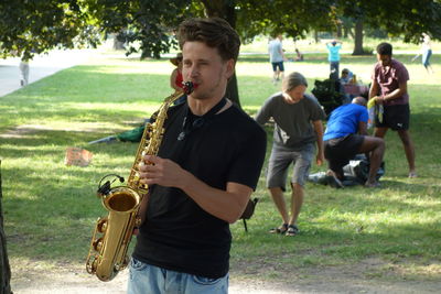 Young man playing in park