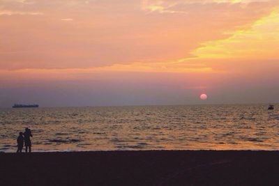Scenic view of sea at sunset