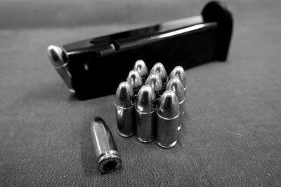 Close-up of gun magazine and bullets