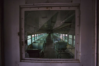 Empty seats in bus seen from window