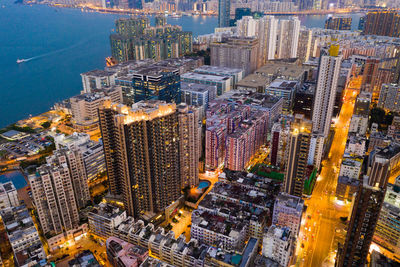 High angle view of illuminated buildings in city