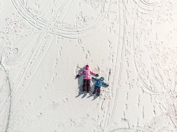 High angle view of umbrella on snow covered land