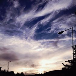 Low angle view of cloudy sky at sunset