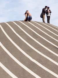 People on road against sky