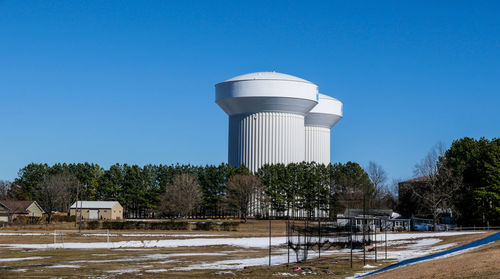 Low angle view of built structure against clear blue sky