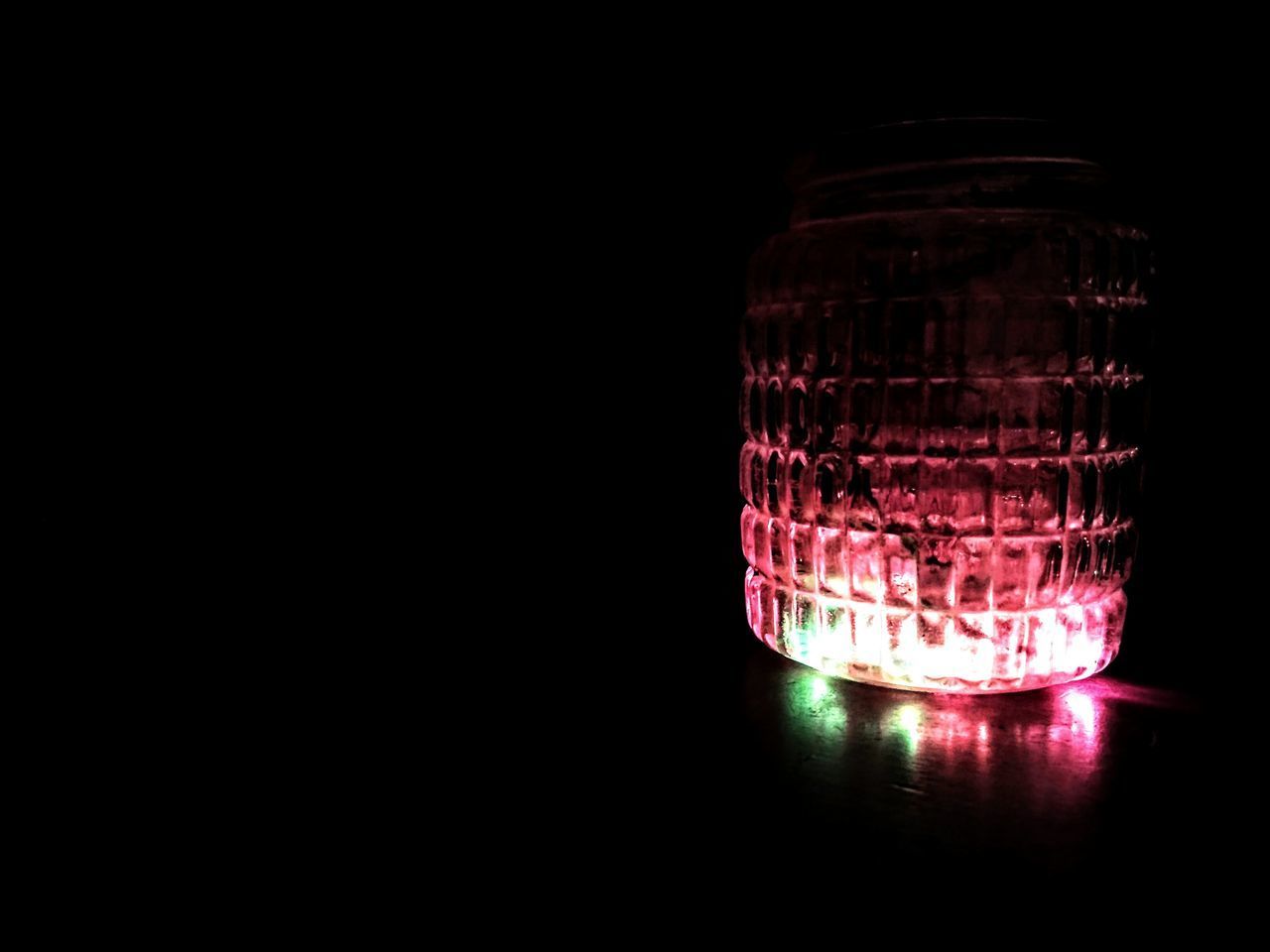 CLOSE-UP OF ILLUMINATED LAMP ON TABLE