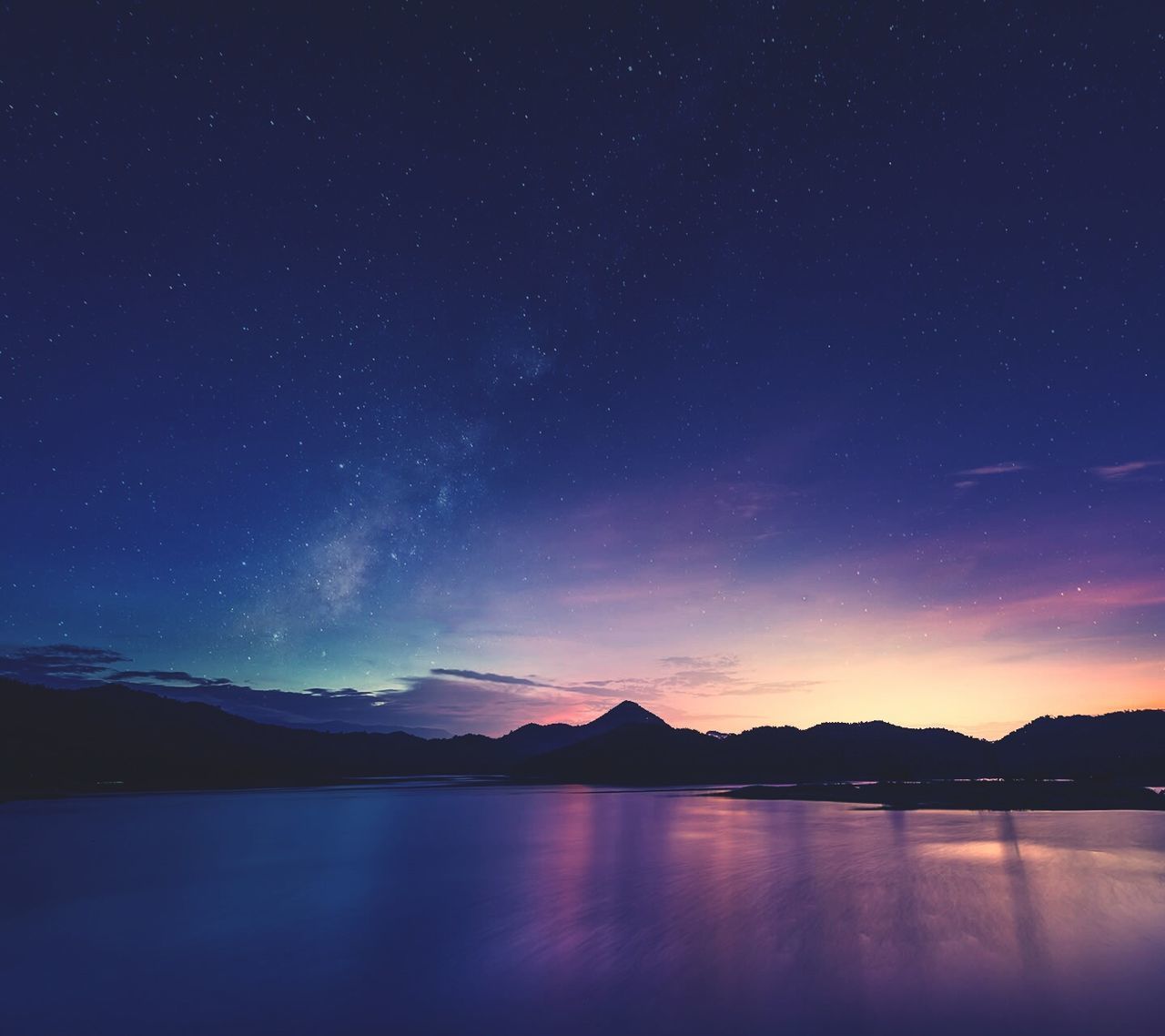 tranquil scene, scenics, tranquility, night, beauty in nature, water, star - space, sky, star field, nature, astronomy, idyllic, mountain, lake, reflection, majestic, waterfront, silhouette, mountain range, galaxy