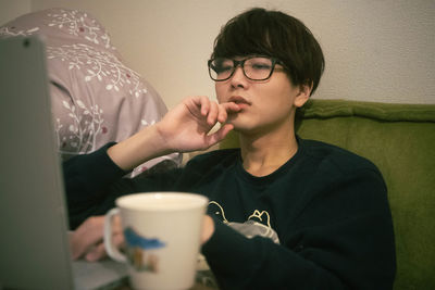 Young man drinking coffee