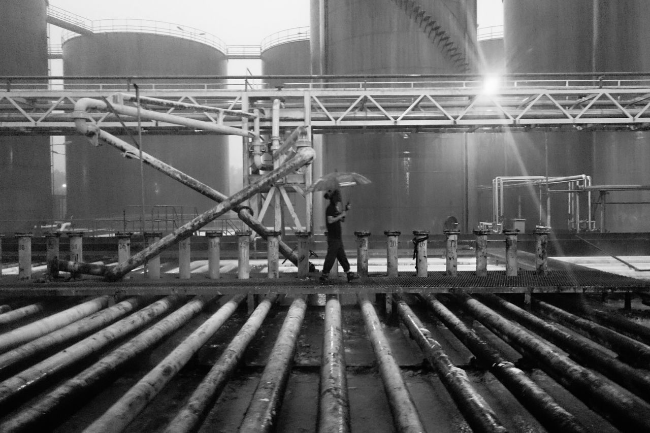 metal, railing, built structure, transportation, connection, bridge - man made structure, architecture, construction site, sunlight, fence, metallic, engineering, industry, outdoors, water, railroad track, development, day, chainlink fence, safety