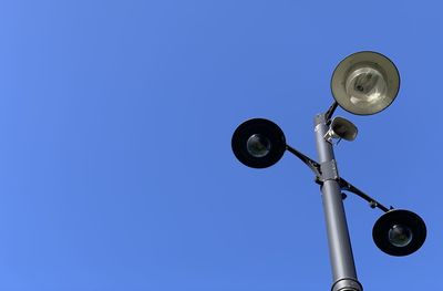 Low angle view of street light against sky