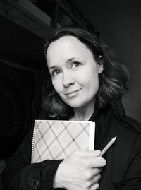 Portrait of young woman holding book