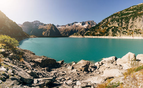 Scenic view of lake and mountains against sky