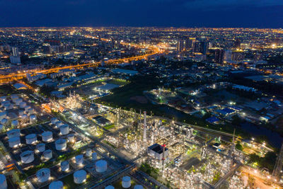 High angle view of illuminated buildings in city at night