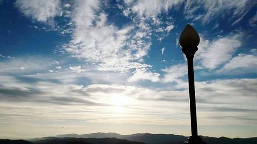 Low angle view of mountain against sky at sunset