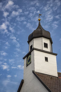 Low angle view of clock tower against sky