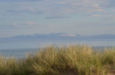 View of calm lake against mountain range