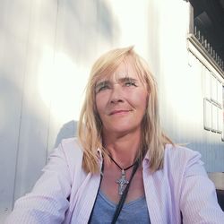 Smiling woman sitting outdoors