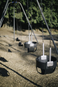 Close-up of swing hanging on tree