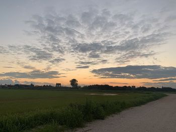 Scenic view of field against sky during sunset