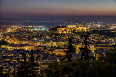High angle view of illuminated buildings in city