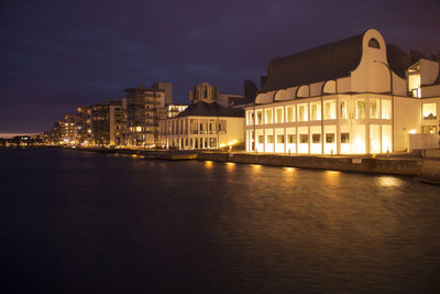 Illuminated buildings at waterfront