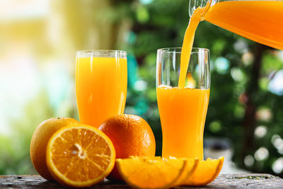 Close-up of orange juice on table