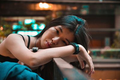 Portrait of young woman in restaurant