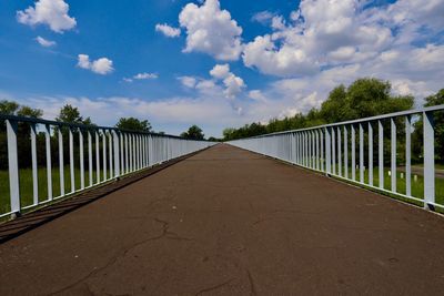 Surface level of empty road against sky