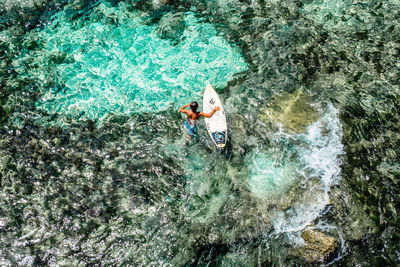 High angle view of man swimming in sea