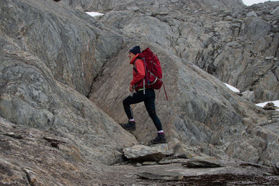 Full length of man standing on rock