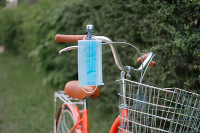 Close-up of bicycle in basket on field