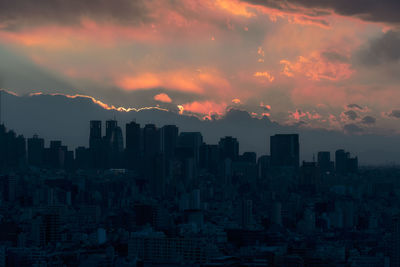 Cityscape against sky during sunset