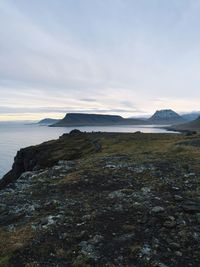 Scenic view of sea against cloudy sky