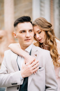 Young couple standing outdoors