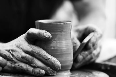 Hands of a potter. potter making ceramic pot on the pottery wheel