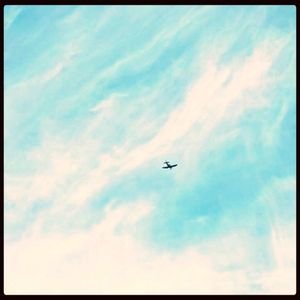 Low angle view of airplane flying in sky